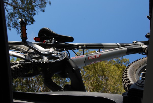 This is a view from inside of the car through the open moon roof. The grey thing in the right of the photo is the front roof rack bar.