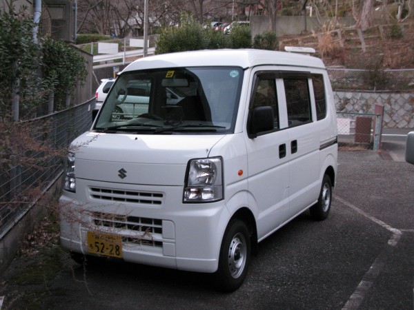 Suzuki Every. This is more of a work vehicle, like a kei-truck with a covered body. Not really a family vehicle. These things are everywhere and often used as delivery/contractor vehicles.