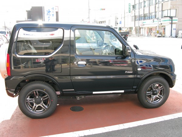 Jimny side. This model was the X-Adventure trim with a Salomon package. The darkened wheels looked great with the paint scheme.