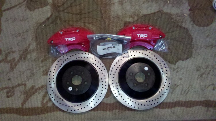 STEP 1 PICTURE WOULD NOT LOAD SO HERE IT IS TRD SCION XB BIG BREAK KIT INCLUDESCALIPERS ROTORS PADS AND STEAL BRADED LINES
