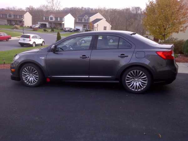 2010 Suzuki Kizashi GTS AWD in Azure Grey with RK Sport Aero package painted semi-gloss black. Red Suzuki symbol.