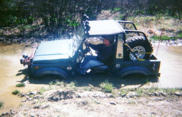 1988.5 Samurai on 33's floating in water. Taken in 1997.